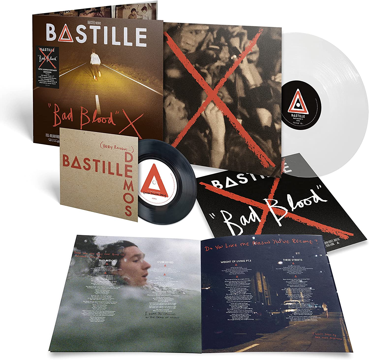 "Bastille Bad Blood X vinyl record set with white and black records and album artwork."