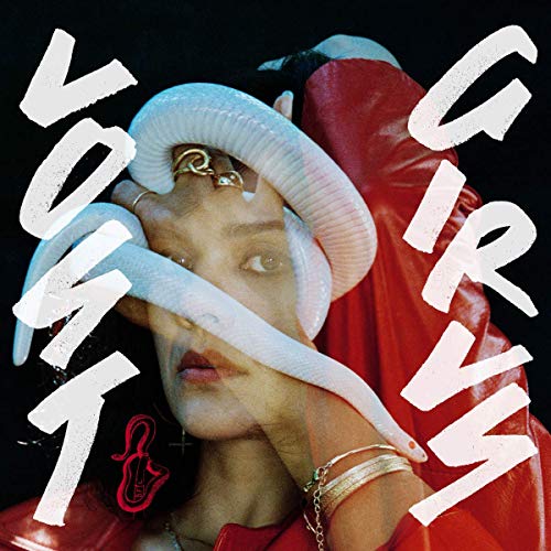 The alt text for the image is: "Album cover with a woman wearing a red jacket and white hat."