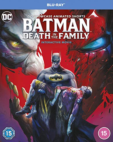 Batman holds an injured figure, with the Joker looming large in the background.