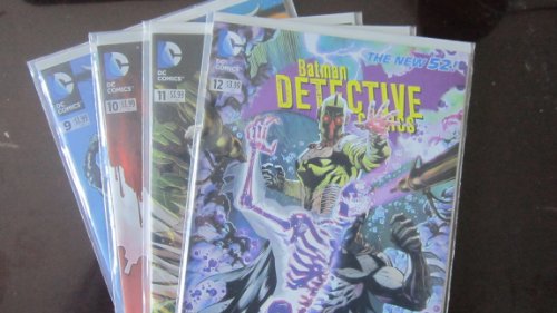 Four bagged Batman Detective Comics issues numbered 9 through 12 in a fan arrangement.