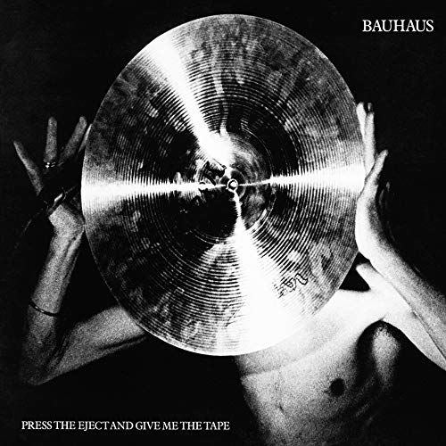 Black-and-white album cover with a person holding a cymbal over their face.