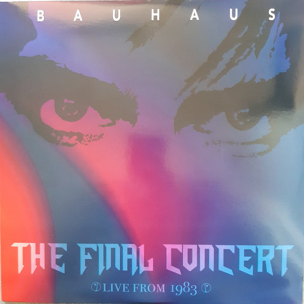 Bauhaus album cover: shadowy figures, purple and red gradient, text details.