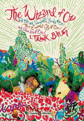 Embroidered book cover featuring The Wizard of Oz characters in a colorful, textured landscape.
