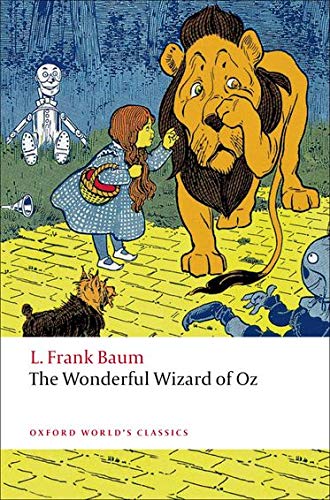 Book cover: Dorothy, Lion, Scarecrow, Tin Woodman on yellow brick road.