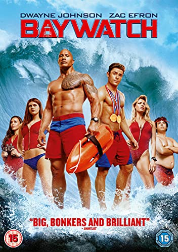 Cast of Baywatch movie standing in ocean waves with a large rescue buoy.