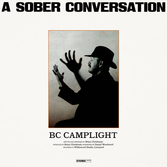 Vinyl record cover: black and white portrait of a man in a hat.