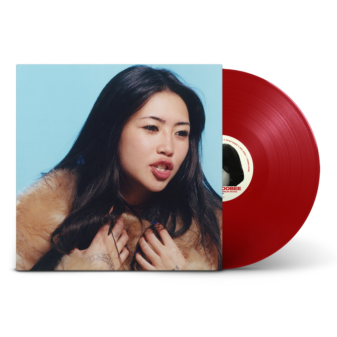 Album cover featuring a woman in a fur coat next to a red vinyl.