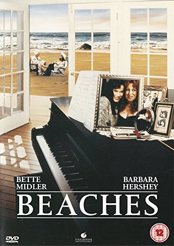 DVD cover showing a piano, framed photos, and a beach view with two women.