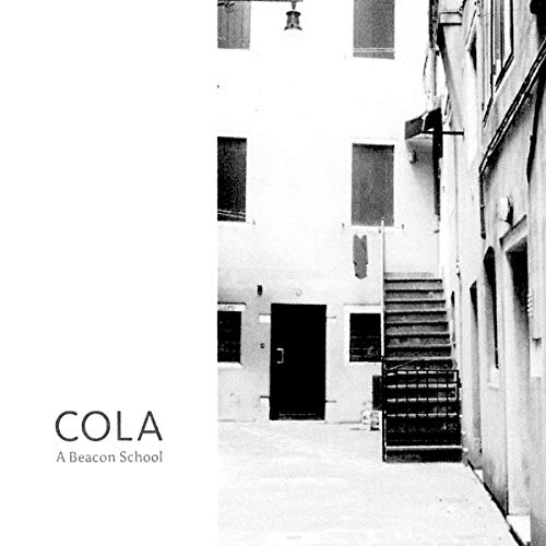 Black and white vinyl record cover depicting a narrow building exterior.