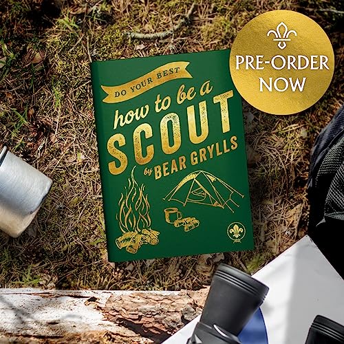 Green book titled How to be a Scout by Bear Grylls on forest floor.