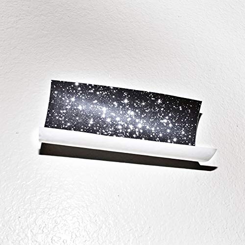 Vinyl record in white sleeve with starry night sky cover art.