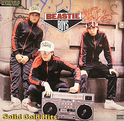 "Beastie Boys album cover featuring three men in black tracksuits posing with a boombox."