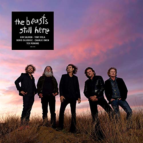 "Album cover featuring five men standing in a field against a purple sky."