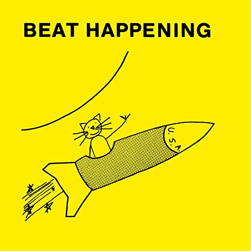 Yellow album cover with a cat riding a dotted rocket ship.