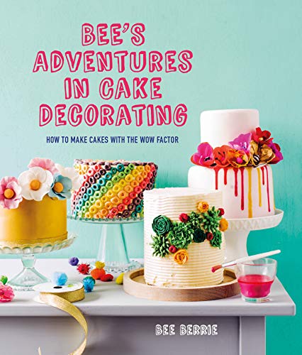 Book cover featuring brightly decorated cakes on a wooden surface.