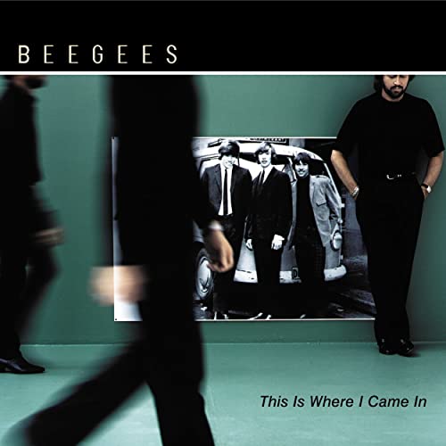 Bee Gees album cover: three men blurred, with a photo within a photo.