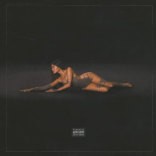 Madison Beer album cover: reclining figure in dark, textured clothing.