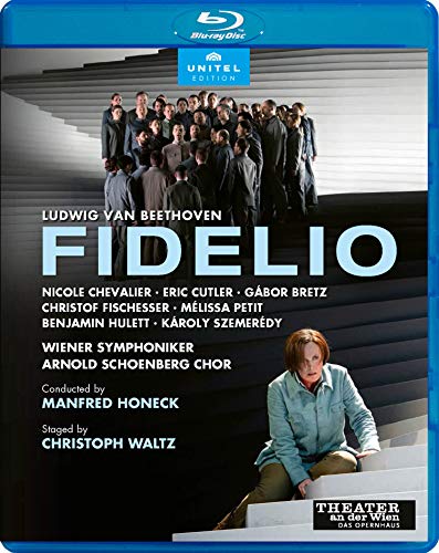 Blu-ray cover for "Fidelio" featuring a woman sitting on steps with men standing above.