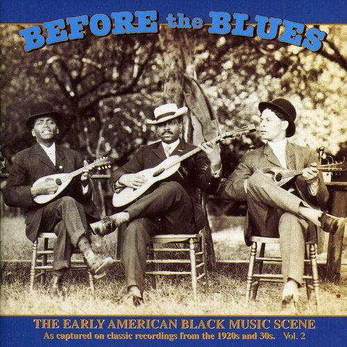 "CD cover with three men playing instruments outdoors, sepia-toned image with blue border."