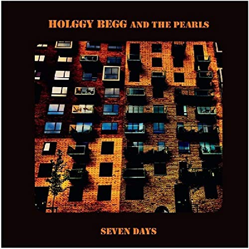 "Album cover featuring a building with lit windows on a black background."
