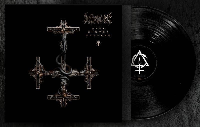 Behemoth album cover with crucifixes and a snake, next to a vinyl record.