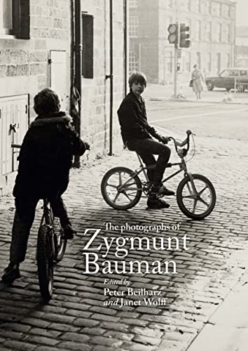 Black and white photograph of two boys with a bicycle, book cover.