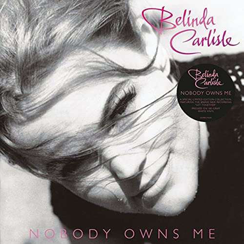 Black and white portrait of Belinda Carlisle with pink text and a hype sticker.