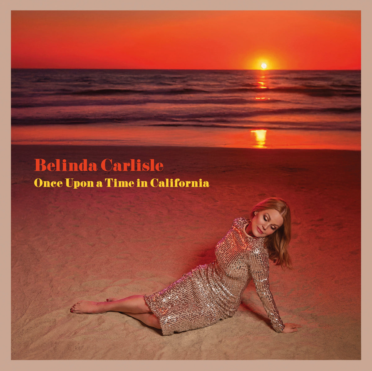 Belinda Carlisle album cover featuring a beach sunset and the artist reclining.