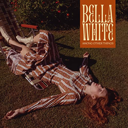 Album cover for Bella White’s “Among Other Things” featuring a woman lying in grass.