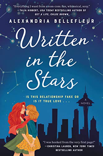 Book cover: “Written in the Stars” depicts two women kissing before a city skyline.