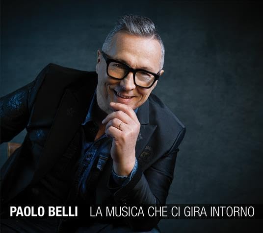 Paolo Belli album cover featuring a smiling man in a suit and glasses.