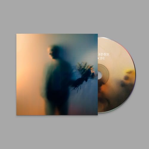 CD case and disc with blurred figure holding flowers in warm and cool tones.