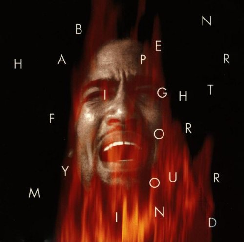 Ben Harper album cover: distorted face with fiery red and black tones.