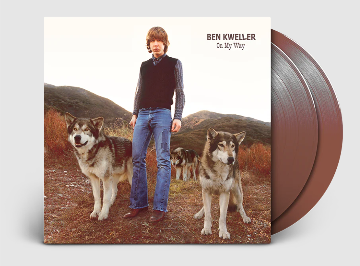 Ben Kweller album cover with a man and dogs, beside a brown vinyl record.
