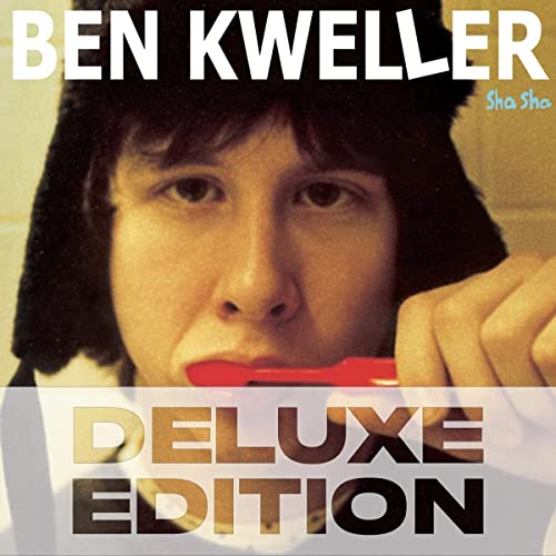 Ben Kweller wearing a black trapper hat and brushing his teeth on album cover.