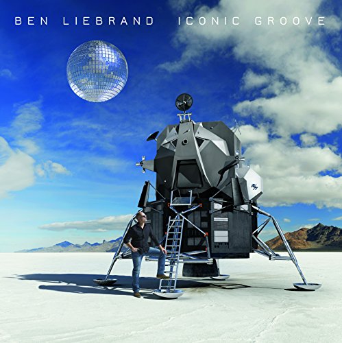 Album cover: lunar lander, disco ball, and a man in a desert landscape.