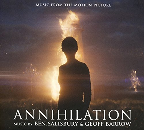 "Album cover with a silhouette of a person standing before a burning building."