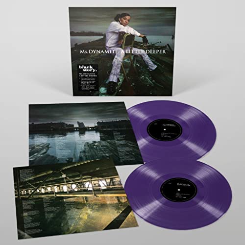Purple marble vinyl records with album artwork and insert cards.