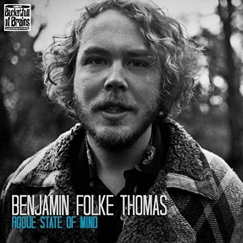 "Album cover with black and white portrait of a man with curly hair."