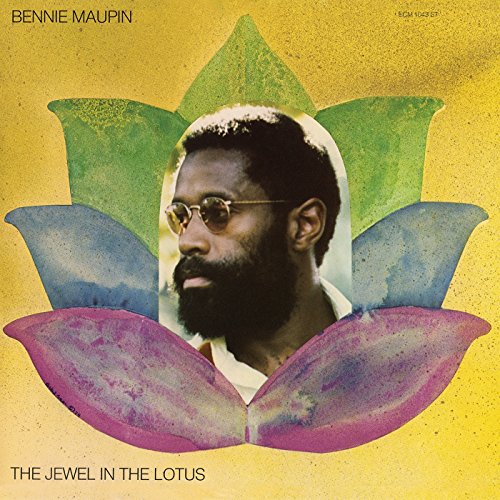 Bennie Maupin portrait centered within a colorful lotus flower design.