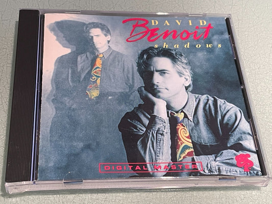 CD case for “Shadows” by Benoit, David, featuring two men’s portraits.