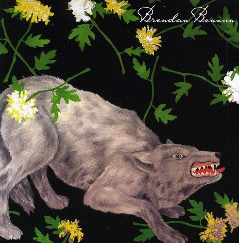 Album cover featuring a snarling grey wolf surrounded by yellow and white flowers on black.