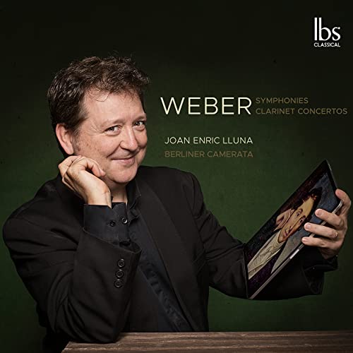 CD cover featuring portrait of a man holding sheet music.