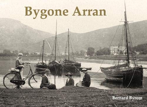 Vintage photograph of boats, people, and a cyclist by a shoreline.