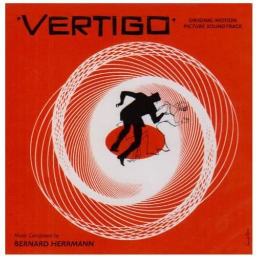 Red album cover for “Vertigo” soundtrack featuring a spiral design and silhouette.