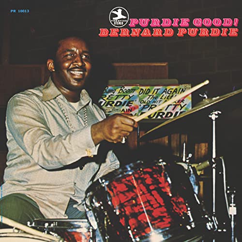 Bernard Purdie smiling at the drums on the album cover “Purdie Good!”.