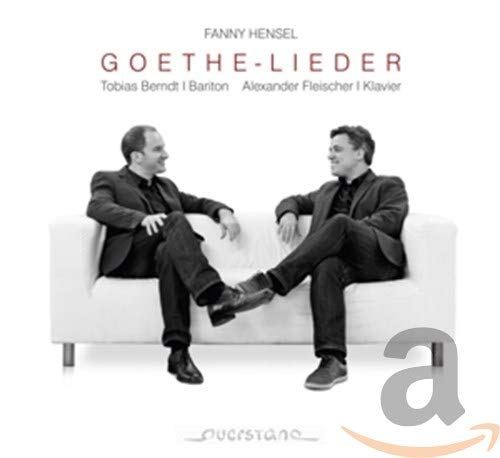 CD cover: two men in suits sitting on a white sofa.