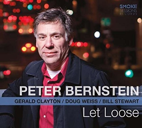 "Album cover featuring a man in a red shirt and black jacket."