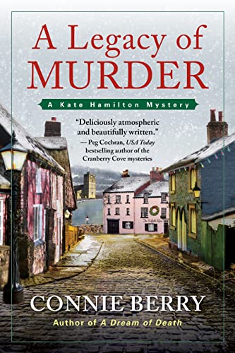 Book cover with cobblestone street and colorful European-style buildings.
