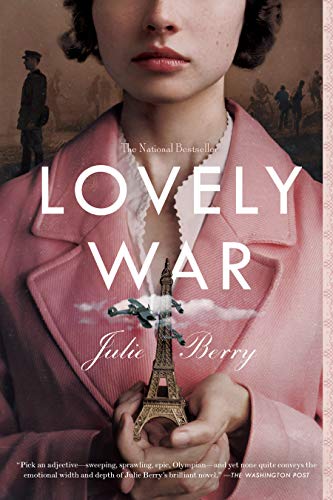 A person in a pink coat holds a miniature Eiffel Tower against a war background.